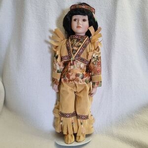 Traditional Doll with Black Hair and Tan Outfit